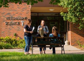 South Dakota State University students gather outside the veterinary science building